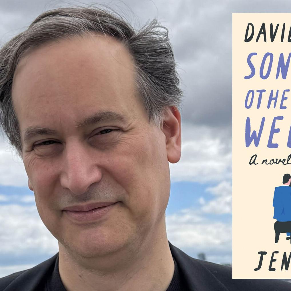 David Levithan wears a black T-shirt that reads "Authors Against Book Bans"